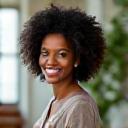 Portrait of Sarah Jenkins, a Black woman with a warm, empathetic expression and dreadlocks.